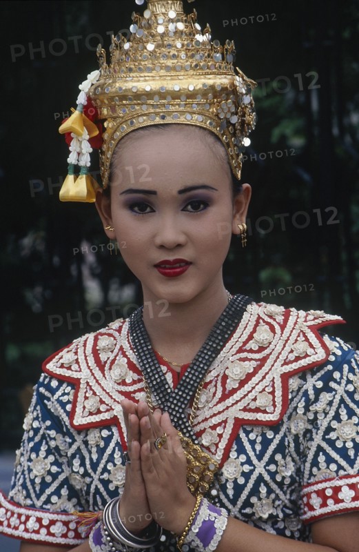 THAILAND, Bangkok, Erewan Shrine Temple Dancer giving a traditional Thai Wai greeting