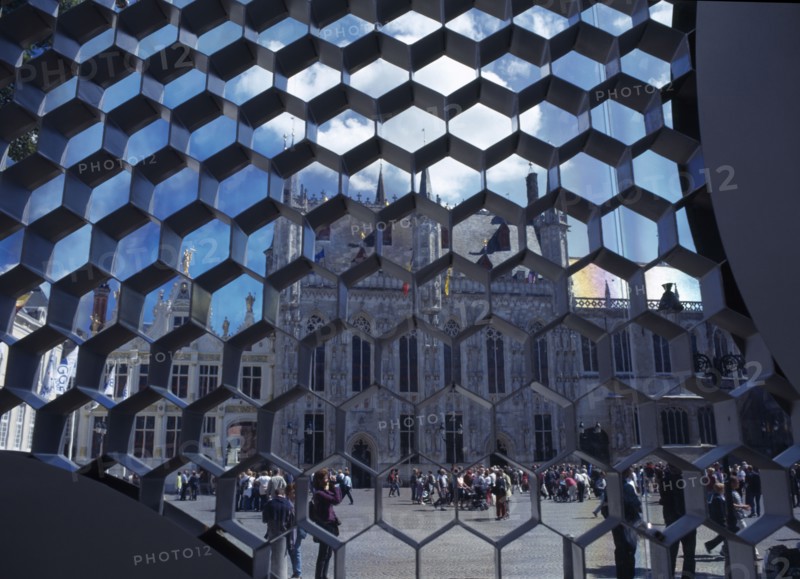 BELGIUM, West Flanders, Bruges, Burg Square with the Stadhuis seen through honeycombe detail of modern sculpture