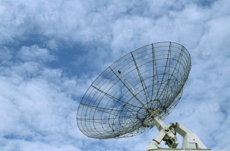 COMMUNICATIONS, Satellite Dish, Satellite dish with a light clouded sky behind