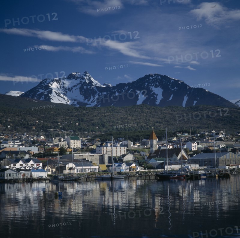 ARGENTINA, Patagonia, "Tierra del Fuego Ushuaia, Bahia Ushuaia, view of town, snowcapped mountains across water 259708 "
