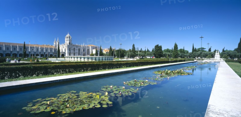 PORTUGAL, Estremadura, Lisbon, Jeronimos Monastery with waterlilly pool in foreground.