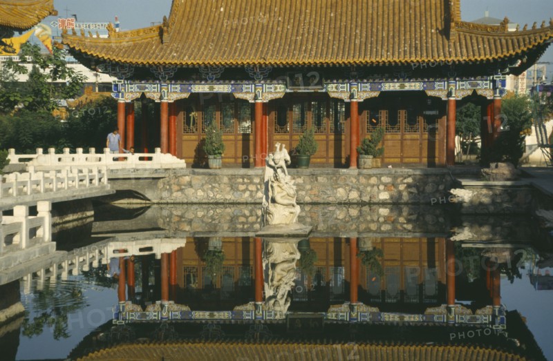 CHINA, Ningxia, Yinchuan , Pavilion in the Park reflected in pool in the foreground