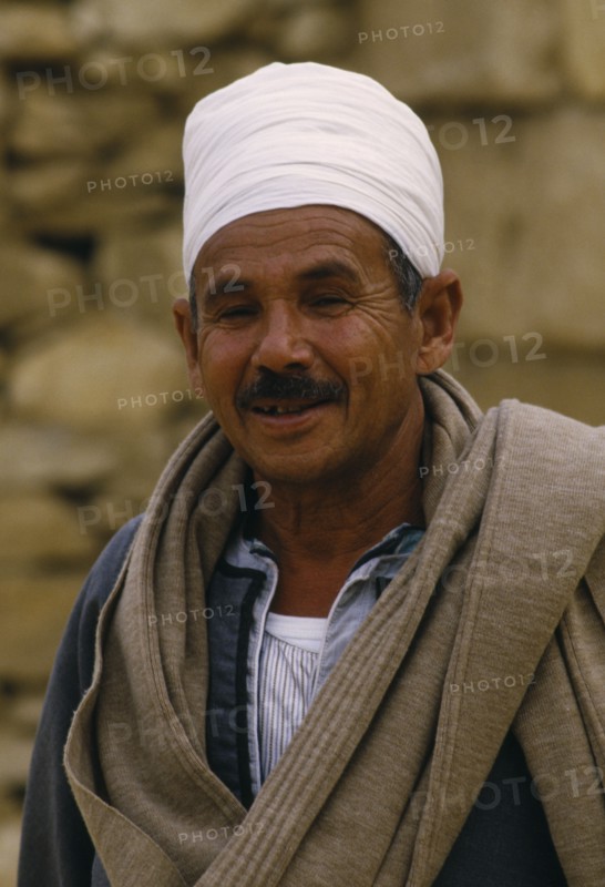 EGYPT, Cairo Area, Saqqara, Smiling guide wearing white turban