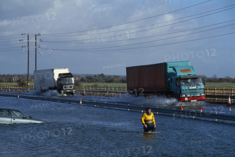 WEATHER , Rain, Flooding , Chichester by-pass with traffic driving through flood water