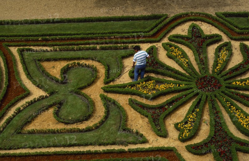 FRANCE,  , Angers, Chateau Moat Garden with gardener