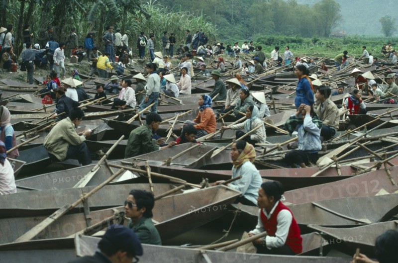 VIETNAM, Central, Hue, Small rowing boats waiting for tourist custom at the Perfume Pagoda.