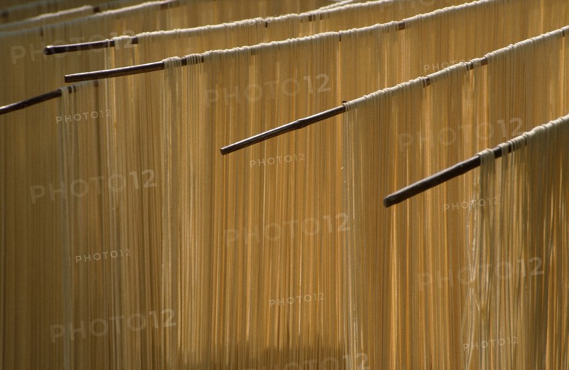 CHINA, Guizhou , Noodles hanging to dry in the open air