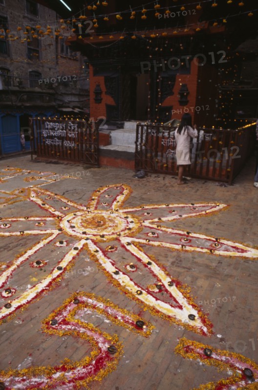 NEPAL,  , Kathmandu, Pattern made from coloured powder and marigold petals for Diwali festival