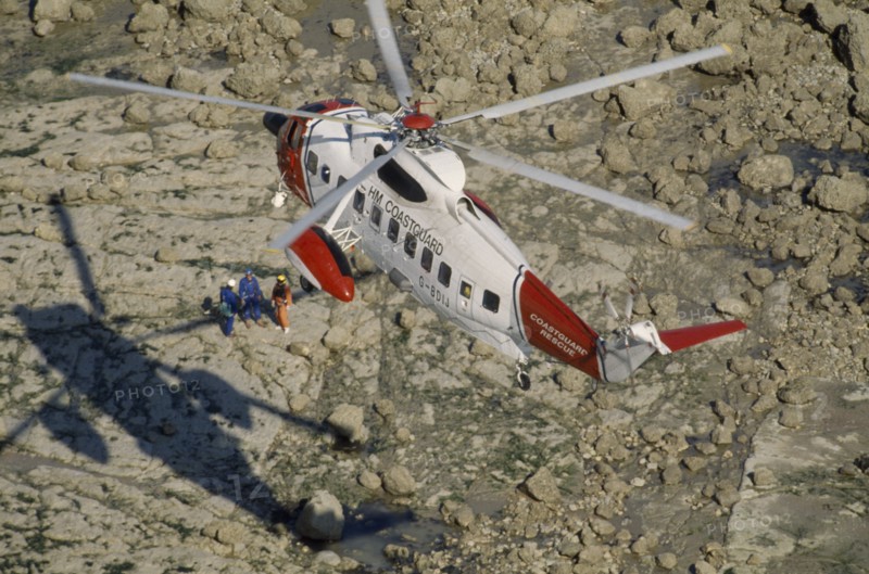 TRANSPORT, Air, Helicopter, Air Sea Helicopter Rescue hovering over rocks