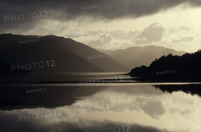 WEATHER, Rain, Rainclouds, Loch Sunart in the Scottish Highlands with the mountains and dark clouds reflected