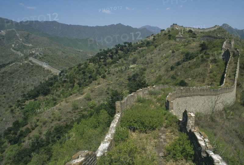 CHINA, Mutianyu, The Great Wall, View along the crumbling wall leading over hills in to the distance