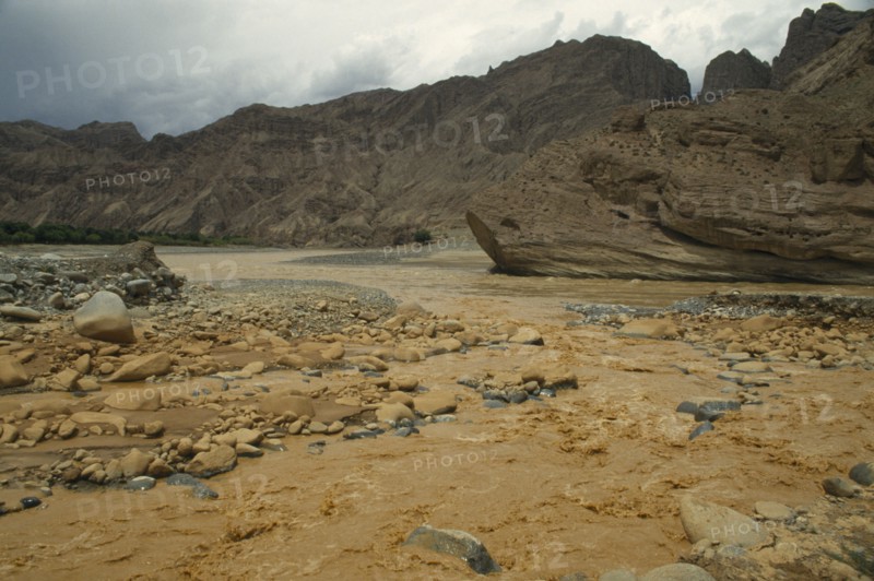 CHINA, Yellow River, Muddy waters flowing through rugged landscape