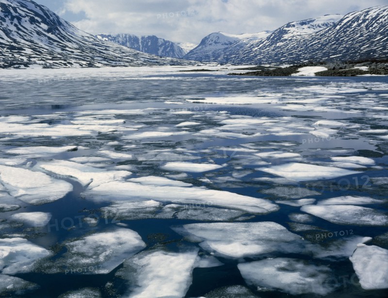 NORWAY, Romsdal, "Geiranger Fjord - Spring,melting ice,snowy mountains behind "