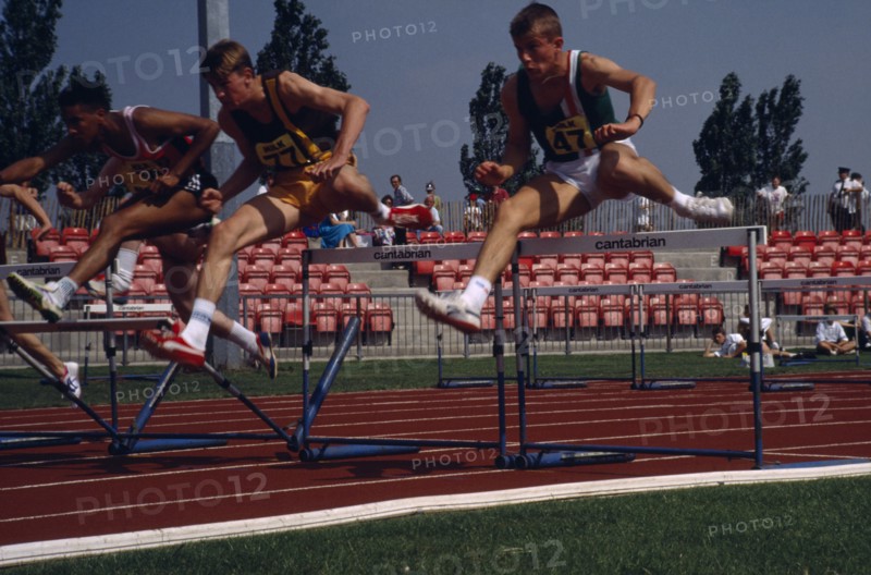 10048210 SPORT Athletics Hurdles Competitor in men s hurdles during school championships.