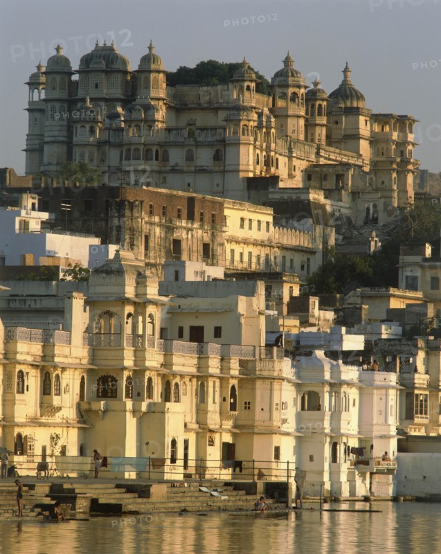 INDIA, Rajasthan, Udaipur, The City Palace in evening sunlight