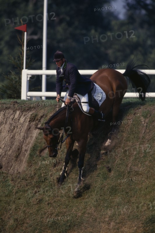 10038993 SPORT Equestrian  Show Jumping Nick Skelton coming down the Derby bank at Hickstead on bay horse.
