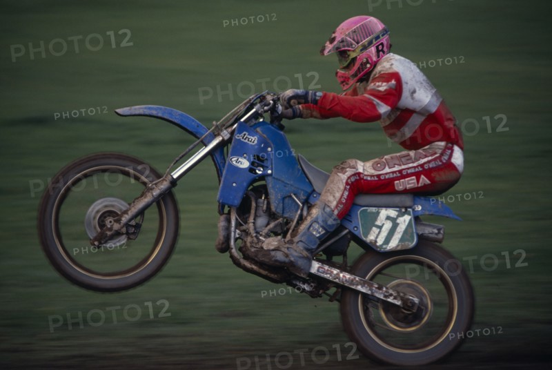 10039001 SPORT Motor Sport Moto Cross Competitor in motorcycle endurance race.
