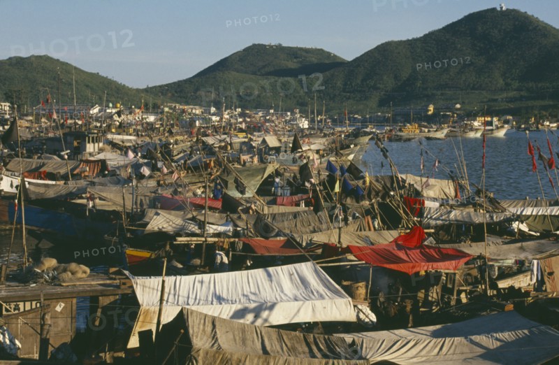 CHINA, Hainan Island, Sanya, The harbour with fishing boats moored alongside each other