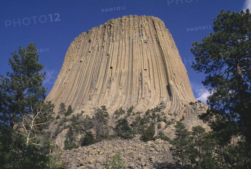 USA, Wyoming, Devils Tower, View looking upwards toward the volcanic outcrop peak of the National Monument