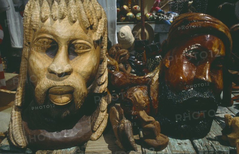 WEST INDIES, Jamaica, Ocho Rios, Wooden carved statues on market stall