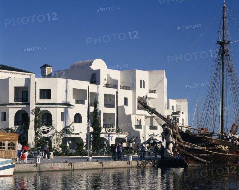 TUNISIA, Port El Kantaoui , View across the marina towards white apartment buildings.