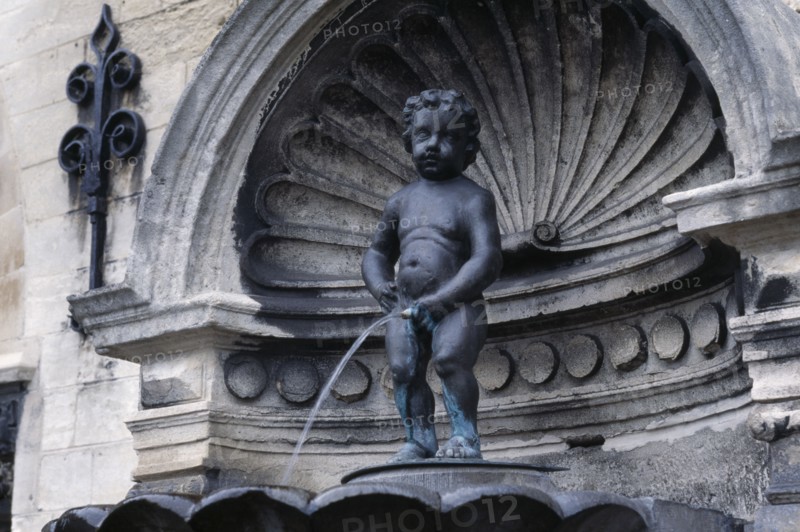 BELGIUM, Brabant, Brussels, "Manneken Pis, a statue of a little boy urinating into the fountain's basin."