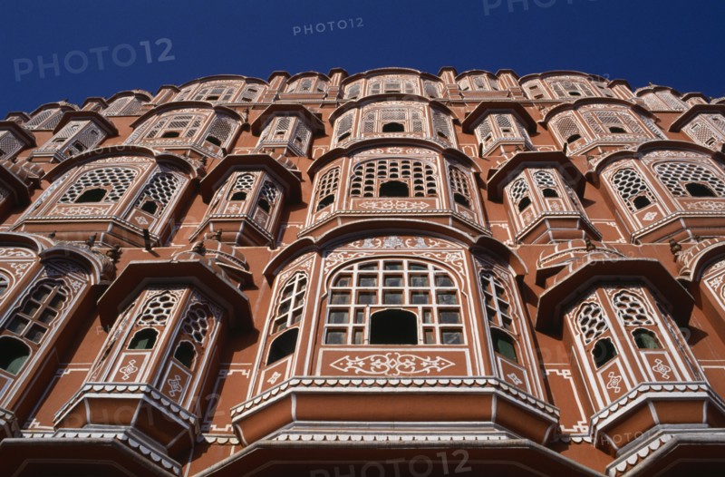 INDIA, Rajasthan, Jaipur, Palace of the Winds aka Hawa Mahal. View looking up the pink and white facade dating from 1799.