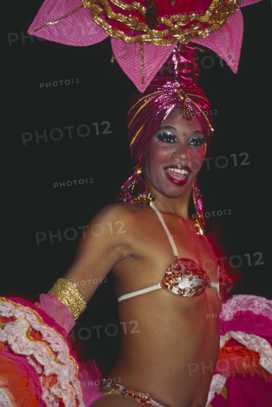 CUBA, Havana Province, Havana, Tropicana Club female dancer in pink costume