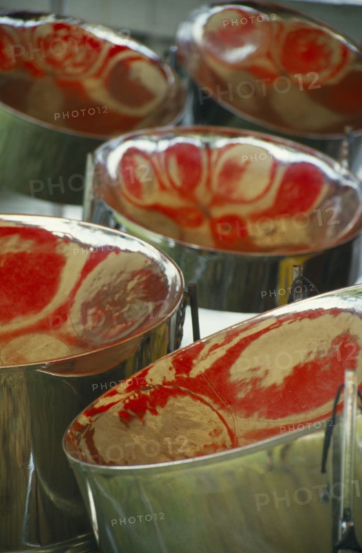WEST INDIES, Tobago, Detail of steel band drums with red reflections