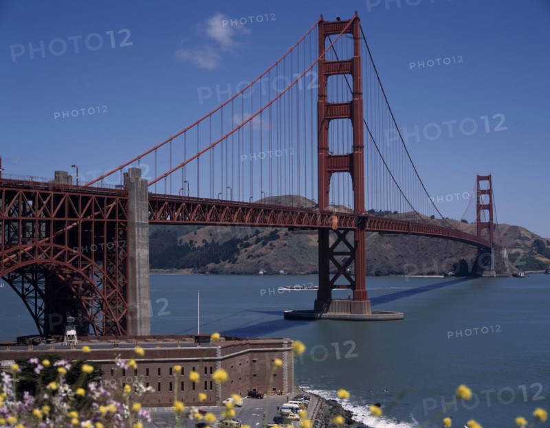 USA, California, San Fransisco, Golden Gate Bridge General view with fort below and hills in the background.