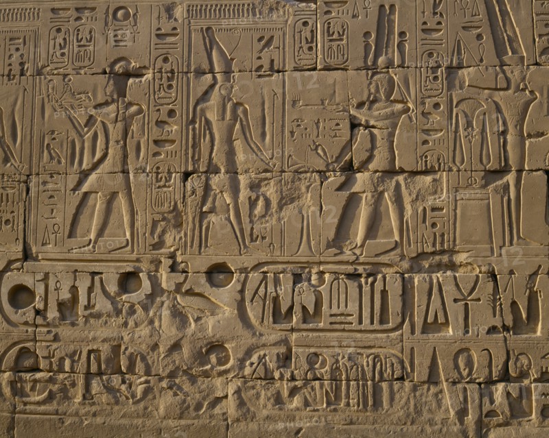 EGYPT, Nile Valley, Karnak, "Karnak Temple.  Hieroglyphic details carved in stone wall, people and symbols. "
