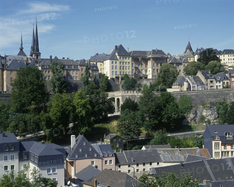 LUXEMBOURG, Luxembourg City, General view across the city rooftops showing city walland distant church spires