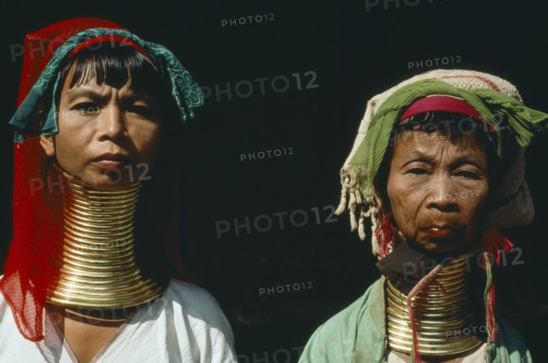 THAILAND, People, Padaung women refugees from Myanmar with their necks encased in traditional rings.