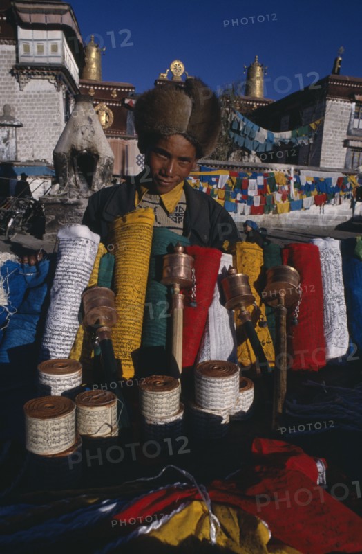 CHINA, Tibet, Lhasa, Prayer flag vendor at Jokhang Temple