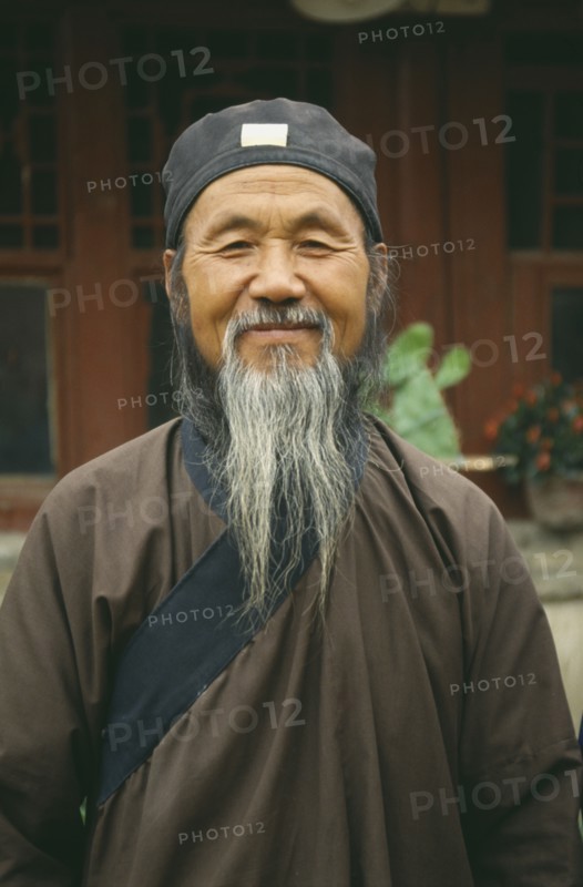 CHINA, Inner Mongolia, Hohhot, Head and shoulders portrait of Taoist / Daoist priest