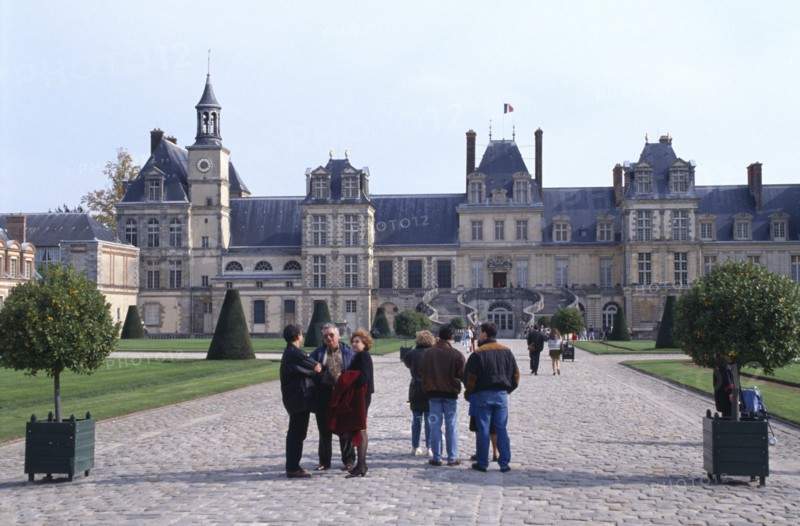 FRANCE,  , Fontainebleau, Palace of Fontainebleau with tourists in courtyard