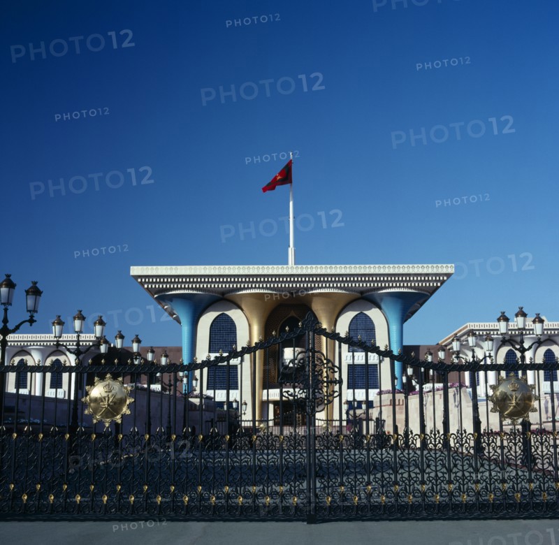 OMAN, Capital Area, Muscat, "Al Alam Palace. Main entranc with blue and gold colomns,ornate gates and flag"