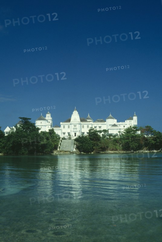 WEST INDIES, Jamaica, Port Antonio, The castle an ornate white building with wide steps leading down to the sea