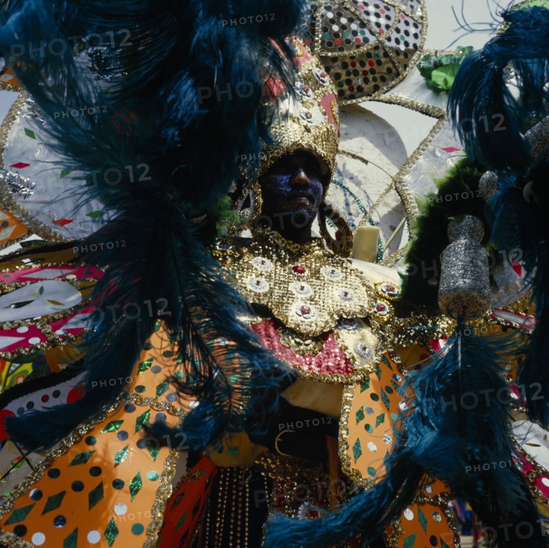 TRINIDAD, Carnival, Carnival dancer wearing brightly coloured extravagant costume.