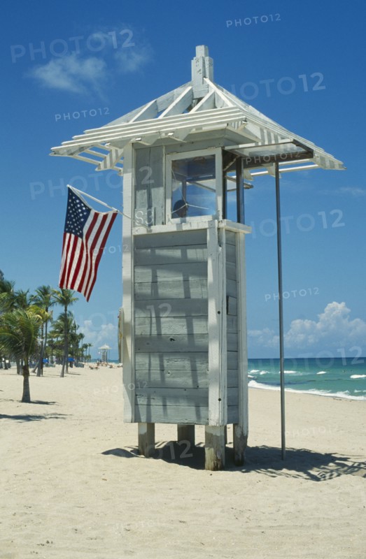 USA, Florida , Fort Lauderdale , Lifeguard post on beach with American Stars and Stripes flag.
