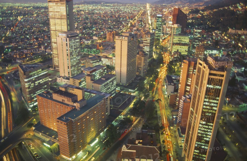 COLOMBIA, Bogota, Aerial view of city highrises illuminated at night