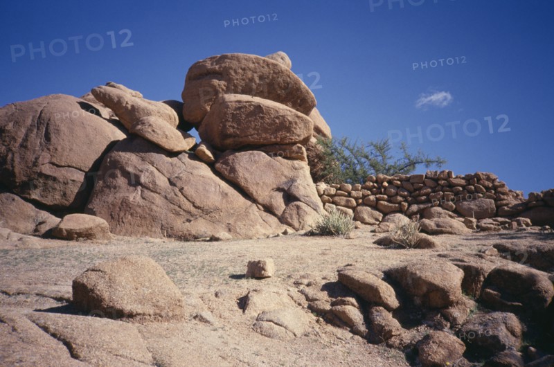 MOROCCO, Anti Atlas, Atlas Mountains, Tafraout. Rocks and stone wall
