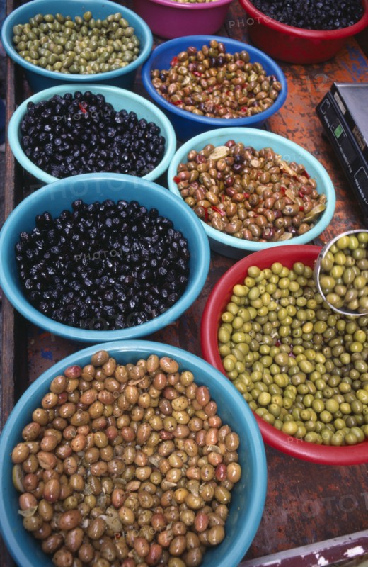 FRANCE, Aquitaine, Issigeac, Varieties of olives in bowls in the weekly Sunday market