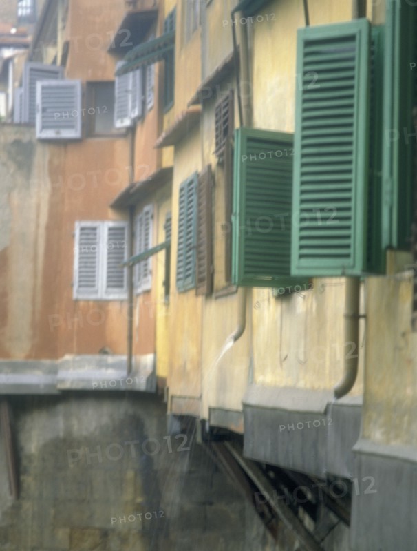 ITALY, Tuscany, Florence, Shutters on houses on  the Ponte Vecchio over the River Arno