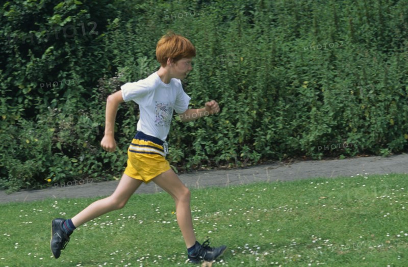 10028025 CHILDREN Leisure Running Young boy running on grass.