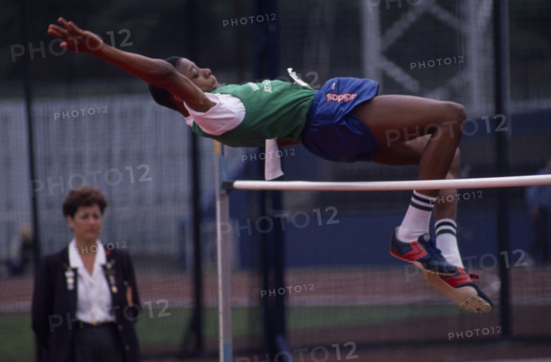 10028033 SPORT  Athletics High Jump Competitor in schools high jump event arching backwards over bar.