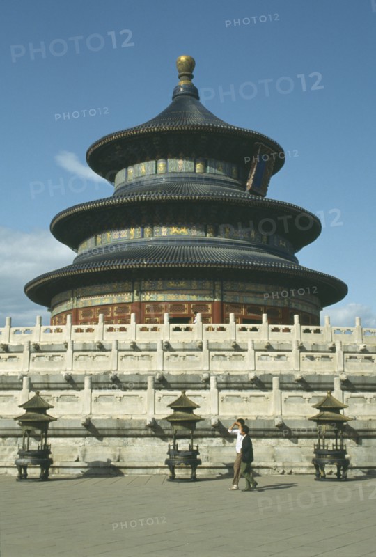CHINA, Hebei, Beijing, Temple of HeavenRound temple standing on a square base with passing men