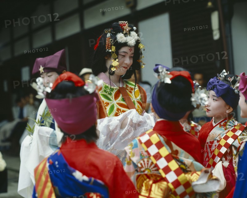 JAPAN, Honshu, Kyoto, The maiden with young boys at the Tanabata Festival