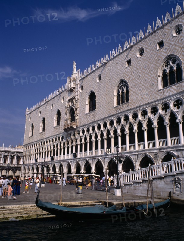 ITALY, Veneto, Venice, Doges Palace aka Palazzo Ducale exterior with moored gondola in the foreground