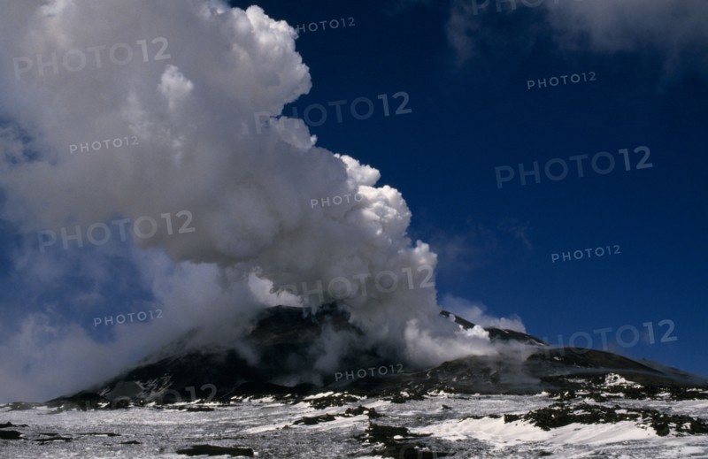 ITALY, Sicilly, Mount Etna, Smoke and ash rising from the snow covered volcano